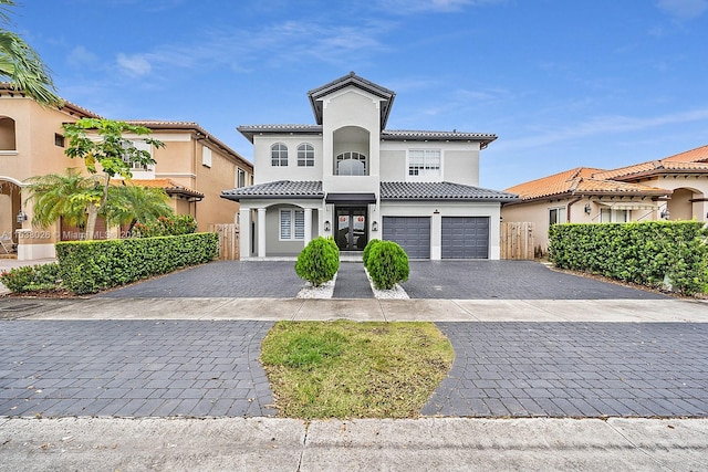 mediterranean / spanish house featuring a garage