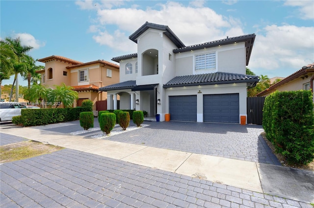 mediterranean / spanish-style house with a garage