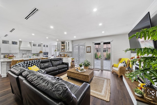 living room featuring dark hardwood / wood-style floors and french doors