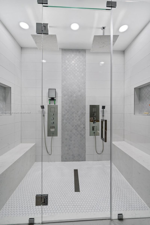 bathroom with a tile shower