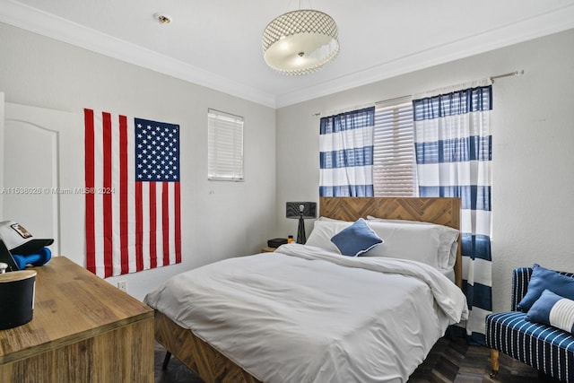 bedroom with ornamental molding and dark parquet floors