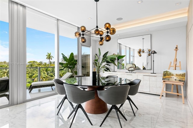 dining space featuring a notable chandelier and light tile floors