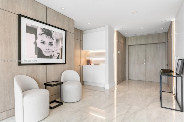 living area featuring light tile floors