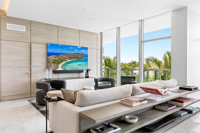 tiled living room with floor to ceiling windows