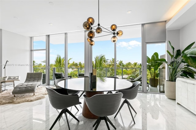 tiled dining space with plenty of natural light, an inviting chandelier, and a wall of windows