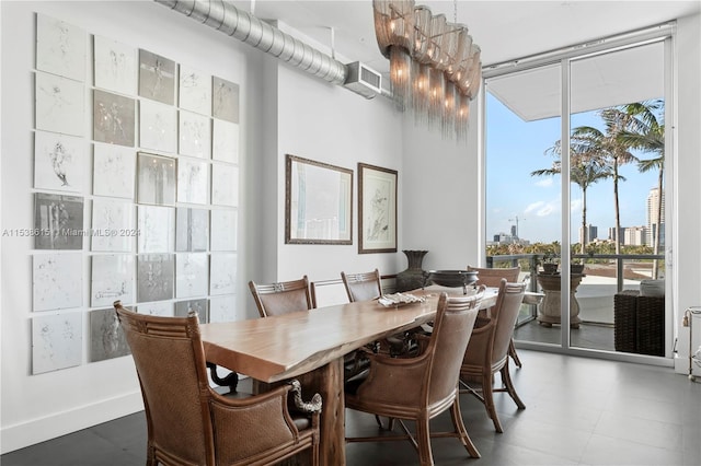 dining area with tile floors and expansive windows