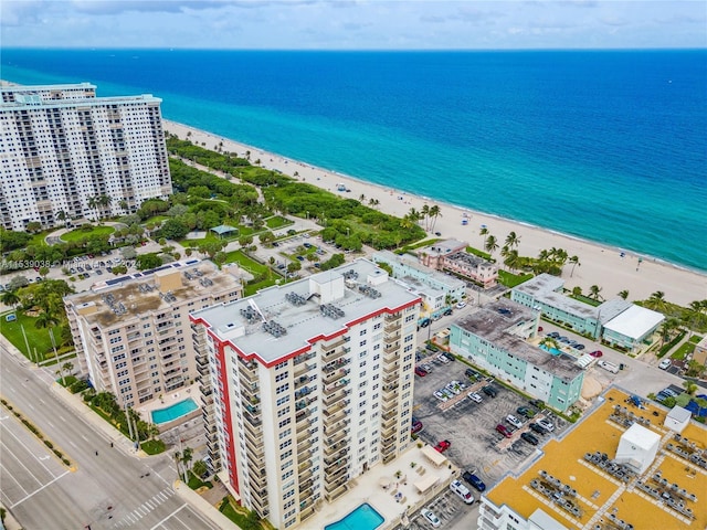 bird's eye view featuring a water view and a view of the beach