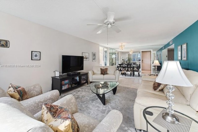 living room featuring ceiling fan and light tile patterned floors