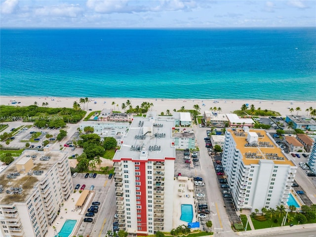 aerial view with a view of the beach and a water view