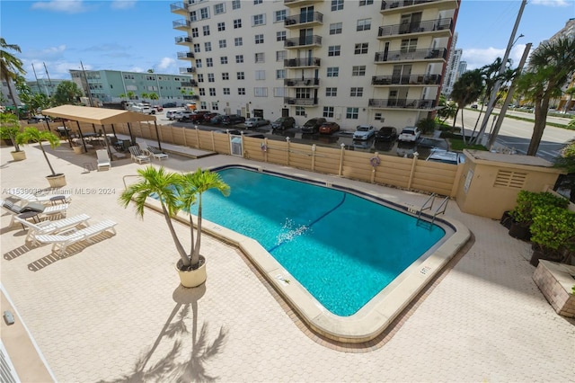 view of swimming pool featuring a patio area