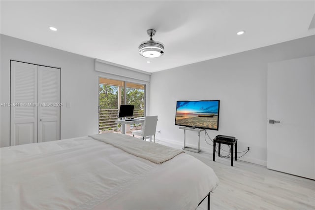 bedroom featuring a closet and light wood-type flooring