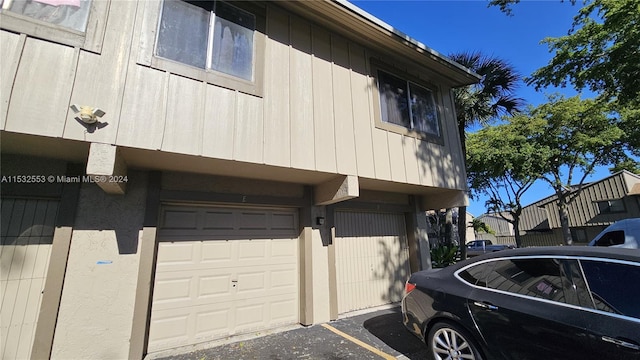 view of side of property featuring a garage