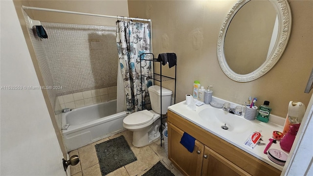 full bathroom featuring shower / tub combo, toilet, tile floors, and vanity with extensive cabinet space