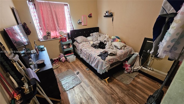 bedroom with light hardwood / wood-style floors