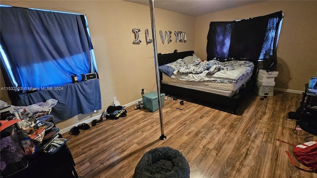 bedroom with wood-type flooring