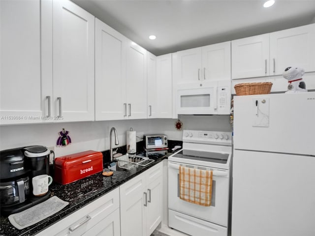 kitchen with sink, white appliances, and white cabinets