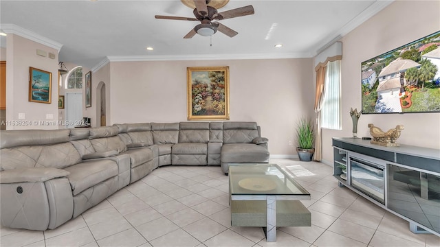 tiled living room featuring crown molding and ceiling fan