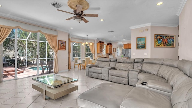 living room featuring ornamental molding, light tile flooring, and ceiling fan with notable chandelier