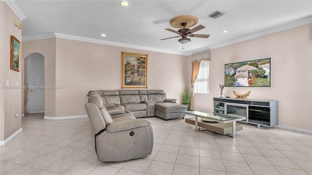 living room featuring light tile floors, ceiling fan, and crown molding