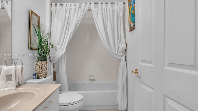 full bathroom with shower / bath combination with curtain, toilet, and vanity