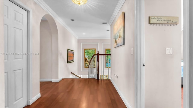 hallway with dark hardwood / wood-style flooring and ornamental molding