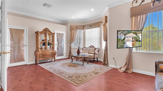 sitting room featuring crown molding and dark hardwood / wood-style flooring