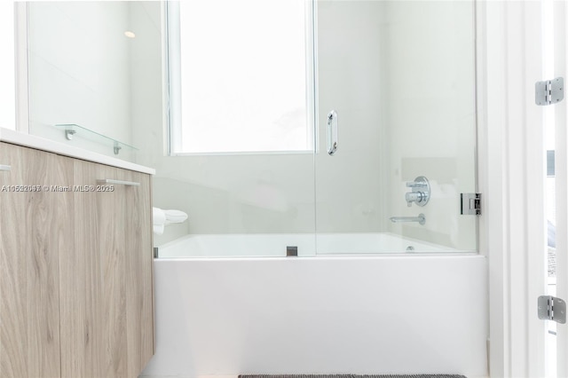 bathroom featuring enclosed tub / shower combo