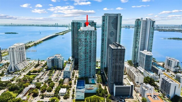 birds eye view of property featuring a water view