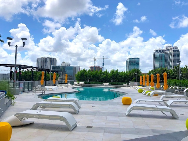 view of swimming pool featuring a patio area