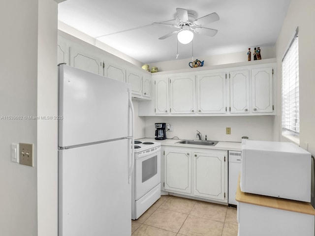 kitchen featuring sink, white cabinets, light tile patterned floors, ceiling fan, and white appliances