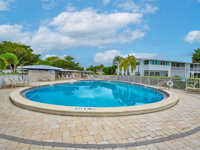 view of swimming pool featuring a patio area