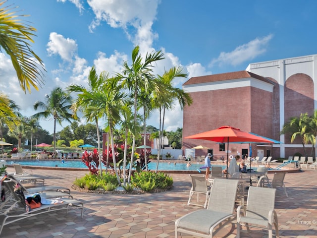 exterior space featuring a swimming pool and a patio area