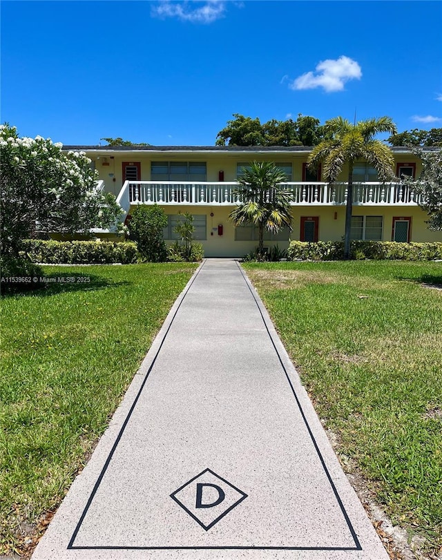 view of front of property with a front lawn