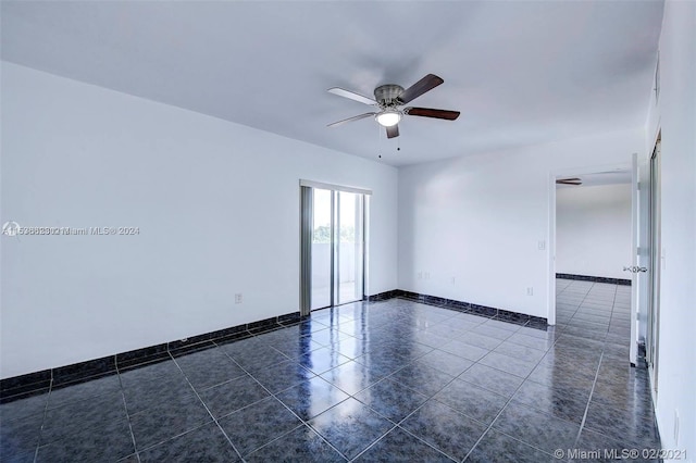 tiled empty room with ceiling fan