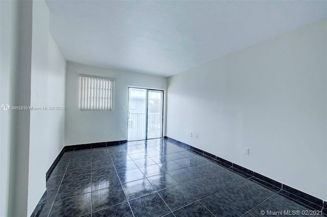 view of tiled spare room