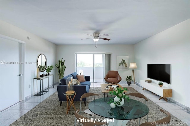 living room with light tile floors and ceiling fan