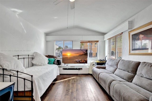 bedroom featuring dark wood-type flooring, ceiling fan, and vaulted ceiling