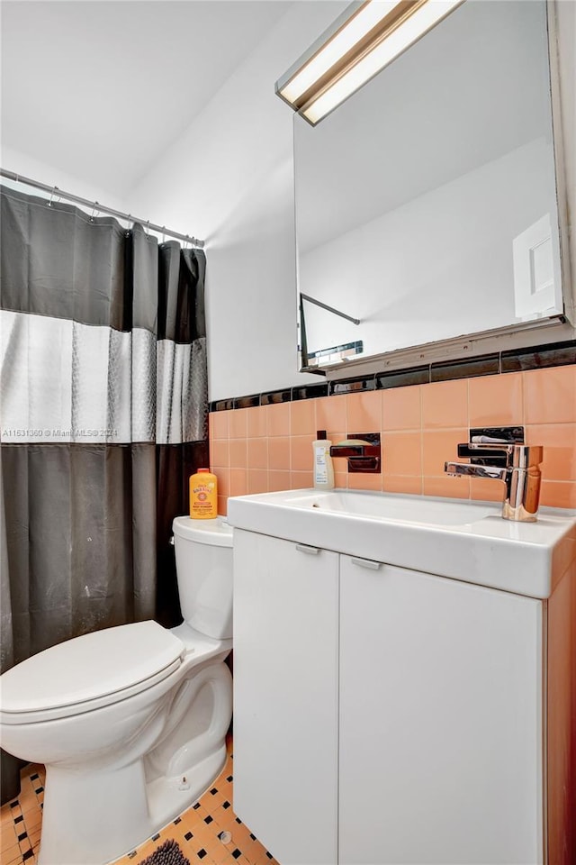 bathroom featuring tile walls, toilet, tile floors, and backsplash