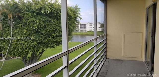 balcony featuring a water view