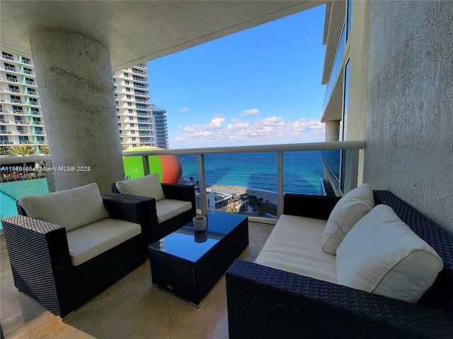 balcony featuring a water view