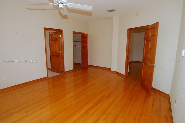 spare room featuring ceiling fan and light wood-type flooring