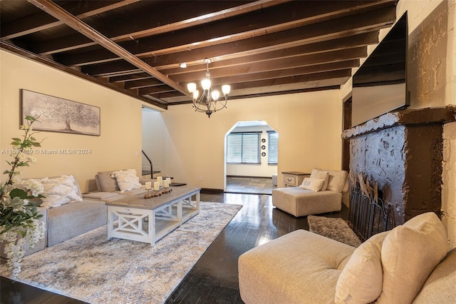 living room featuring beamed ceiling and dark wood-type flooring