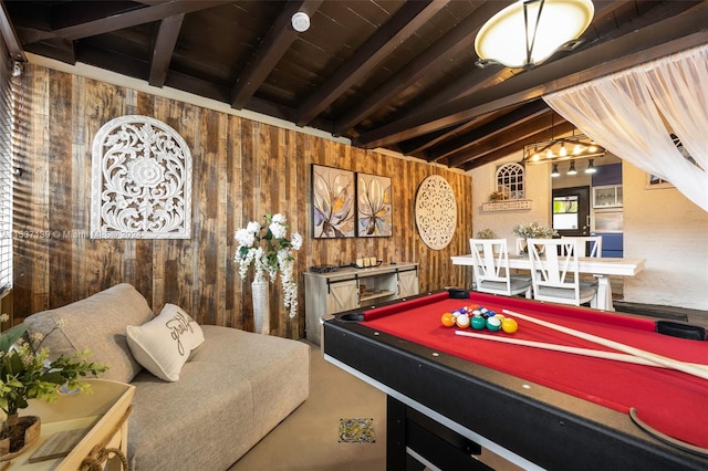 rec room featuring pool table, vaulted ceiling with beams, and wood walls