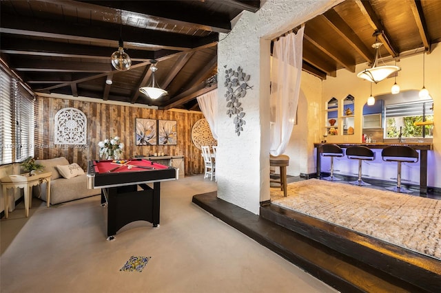 game room featuring concrete floors, pool table, lofted ceiling with beams, wooden ceiling, and wooden walls