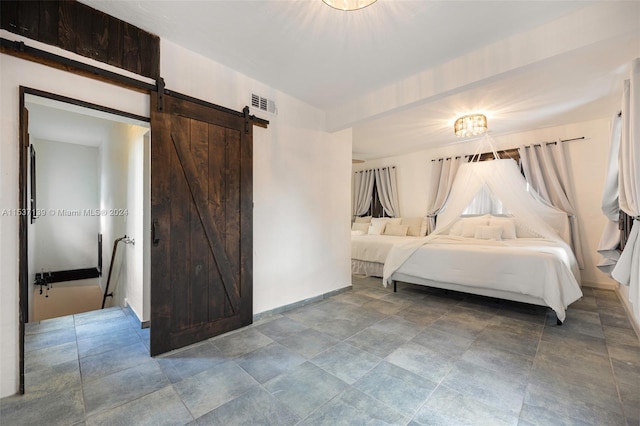 unfurnished bedroom with a barn door