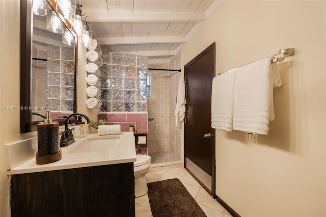 bathroom featuring a shower, toilet, beamed ceiling, vanity, and tile patterned floors