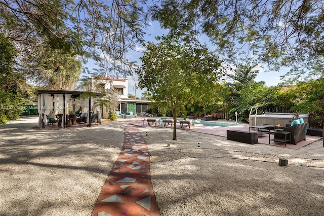 view of yard with an outdoor hangout area and a patio