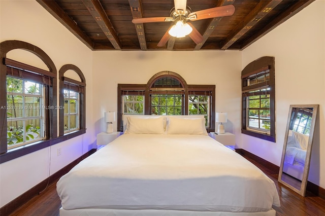 bedroom with dark hardwood / wood-style flooring, wood ceiling, multiple windows, and ceiling fan