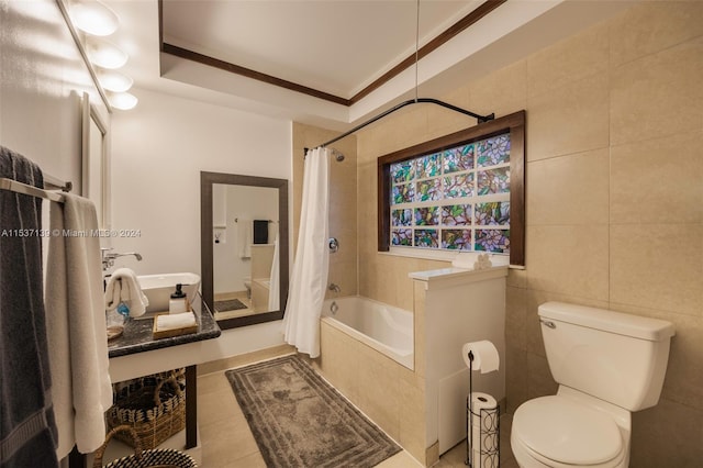 bathroom featuring toilet, shower / tub combo with curtain, tile patterned floors, and tile walls