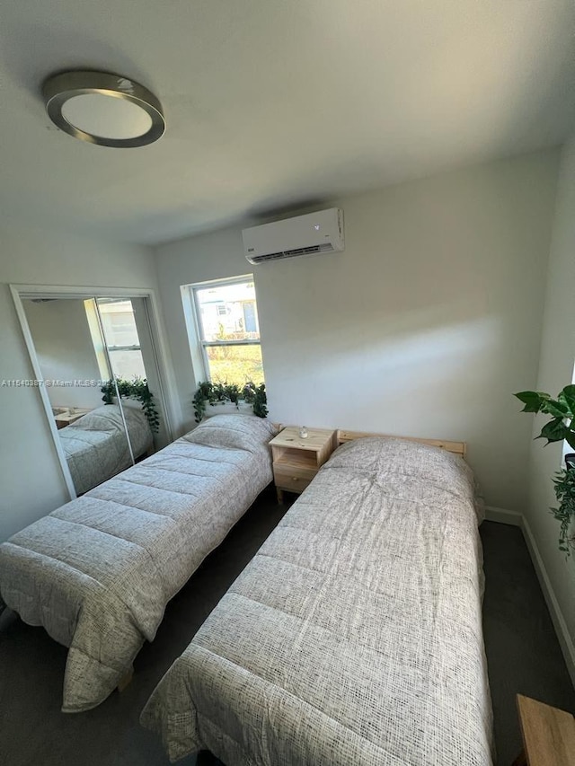 bedroom with an AC wall unit